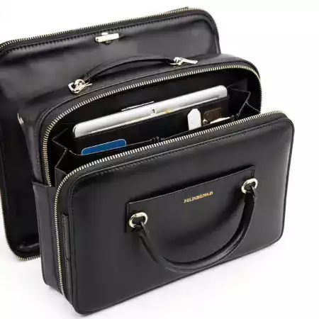 Vibrant silk lining being stitched into a leather bag, showcasing interior customization